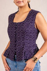 Navy polka dot peplum sleeveless top