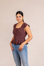 Brown polka dot peplum sleeveless top
