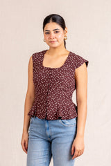 Brown polka dot peplum sleeveless top