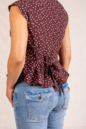 Brown polka dot peplum sleeveless top