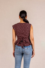 Brown polka dot peplum sleeveless top