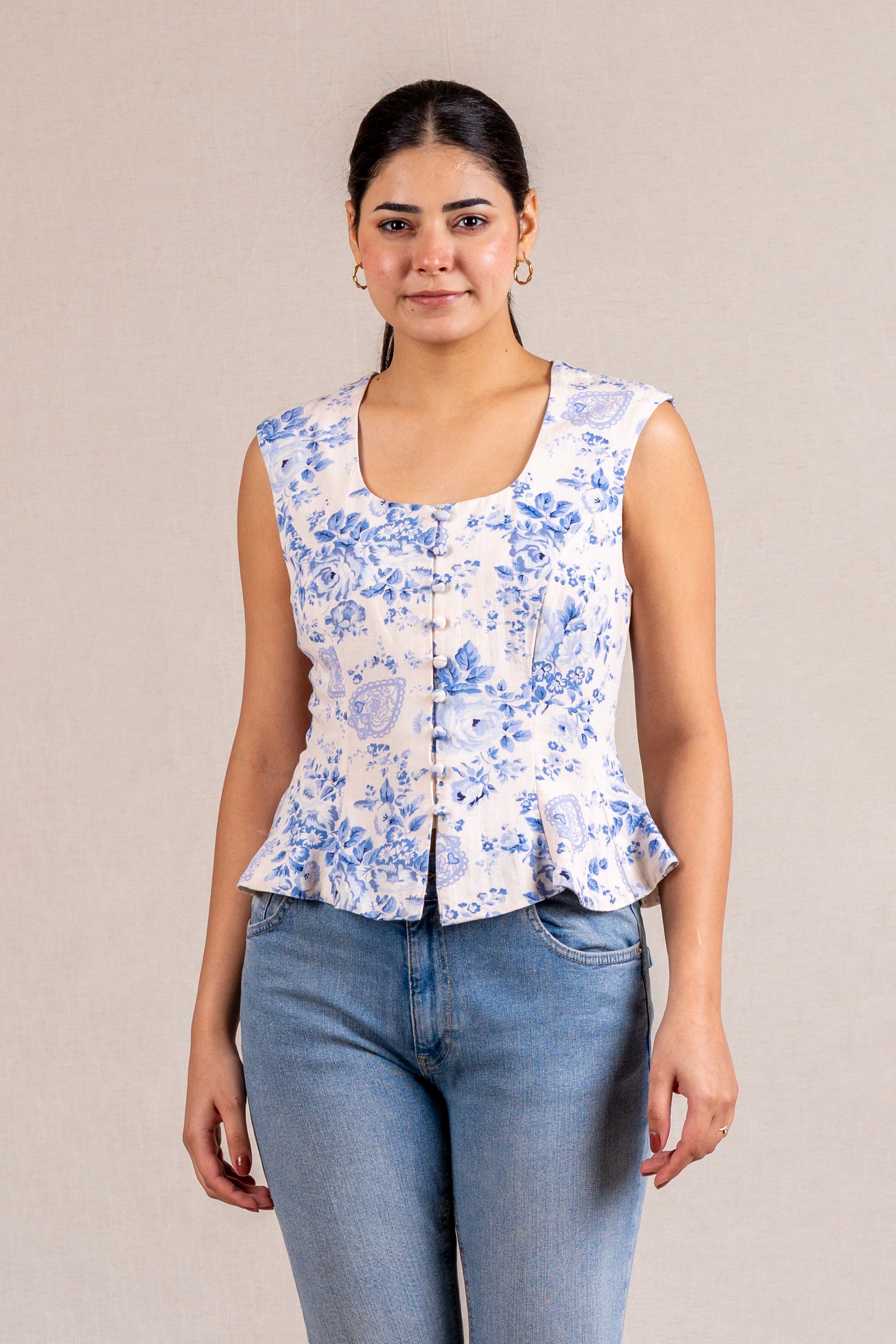 Floral peplum sleeveless top