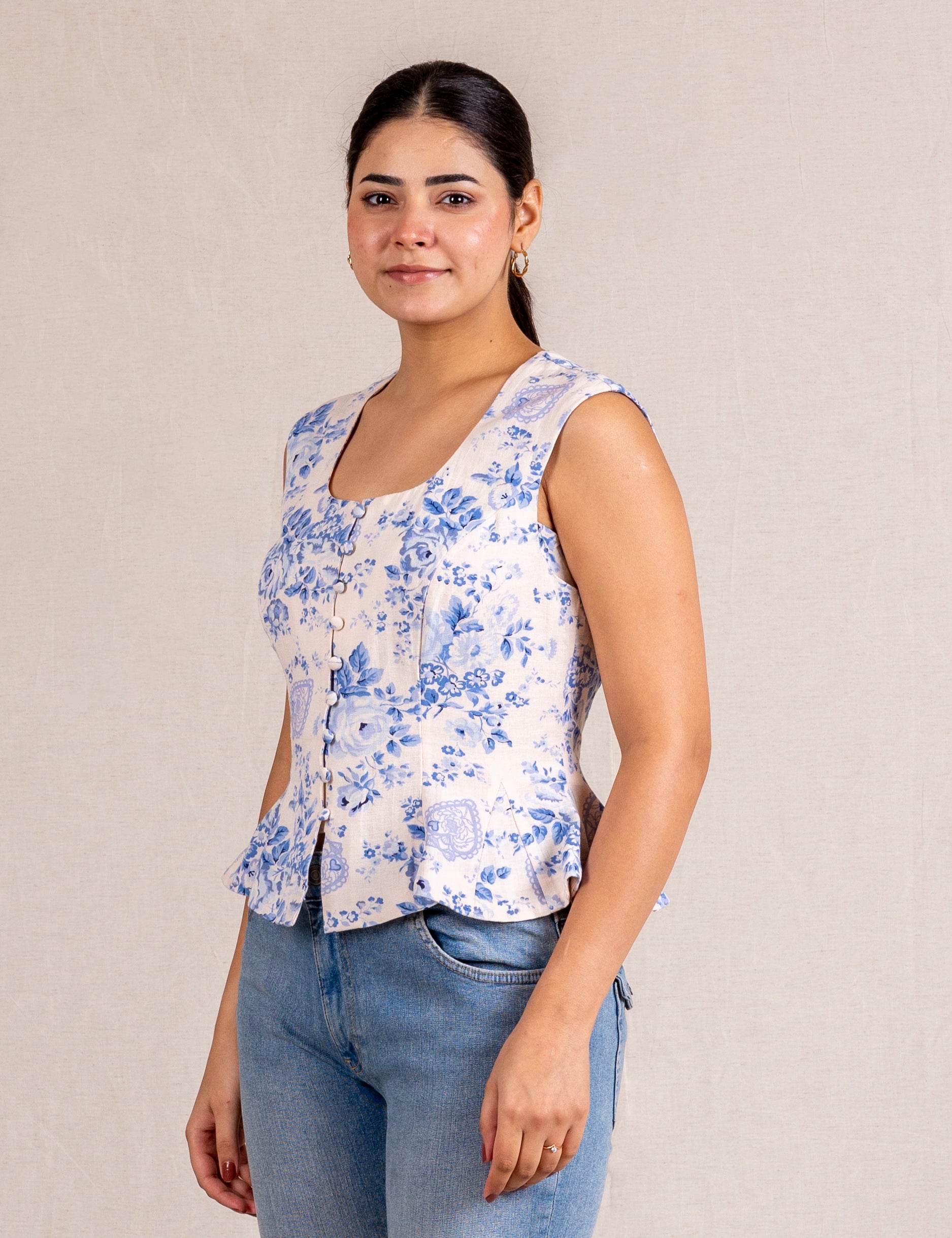 Floral peplum sleeveless top