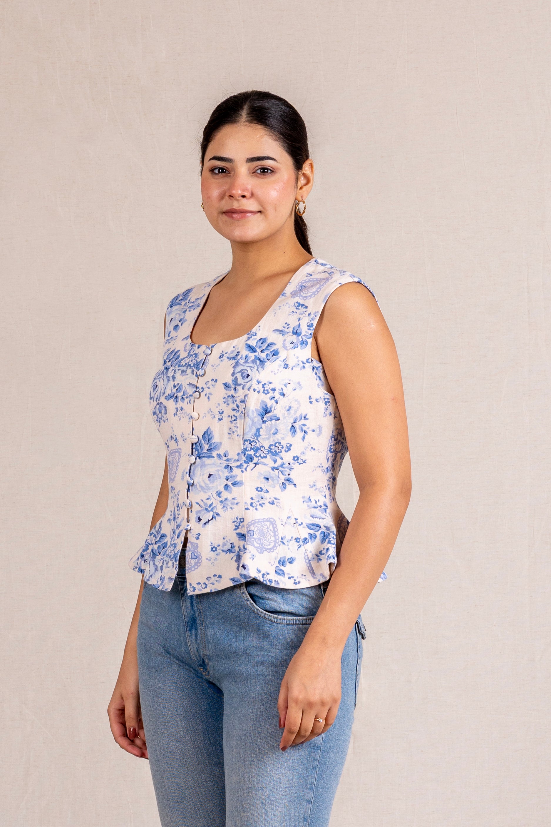 Floral peplum sleeveless top