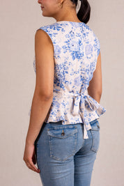 Floral peplum sleeveless top