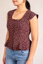 Brown polka dot peplum sleeveless top