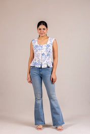 Floral peplum sleeveless top