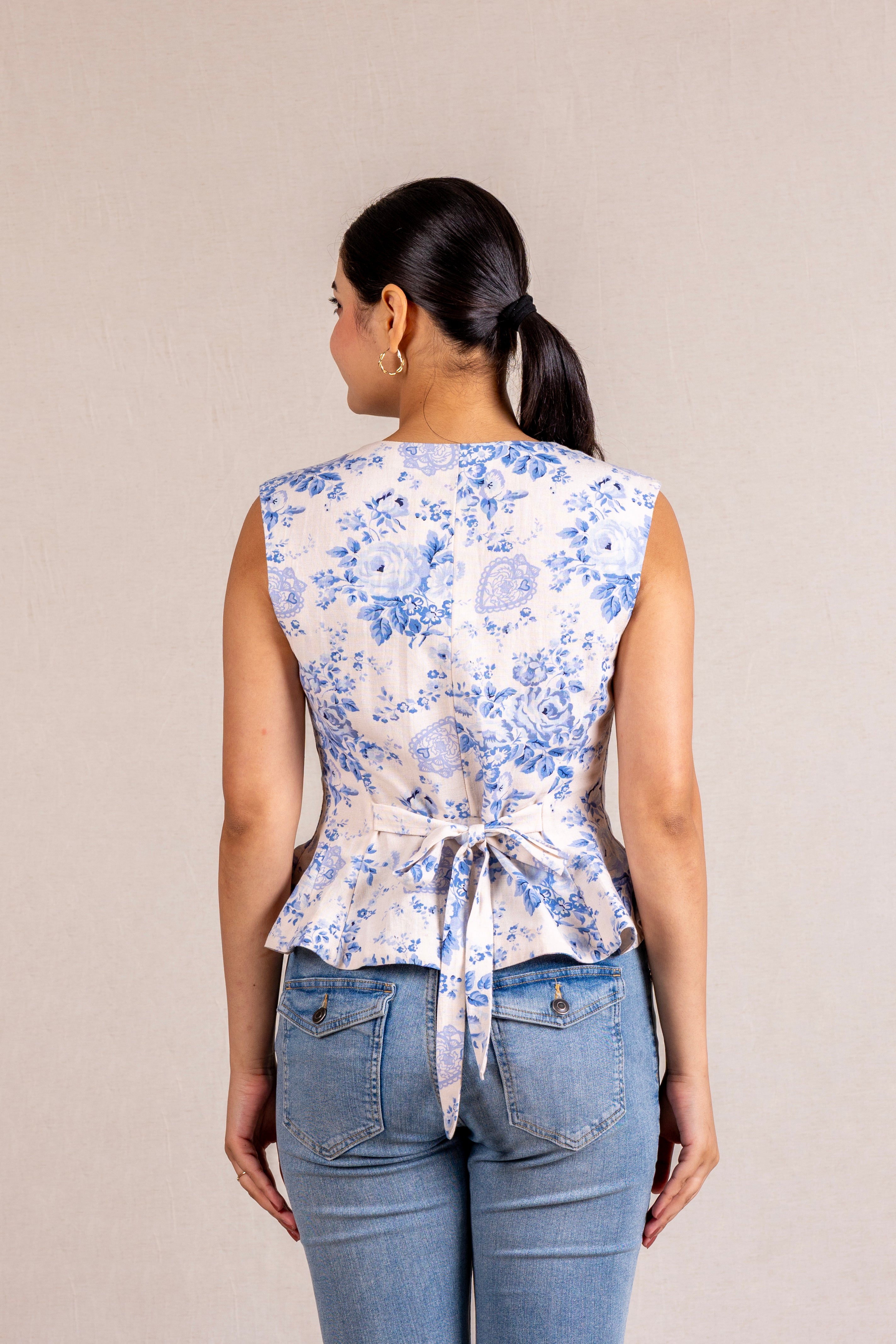 Floral peplum sleeveless top